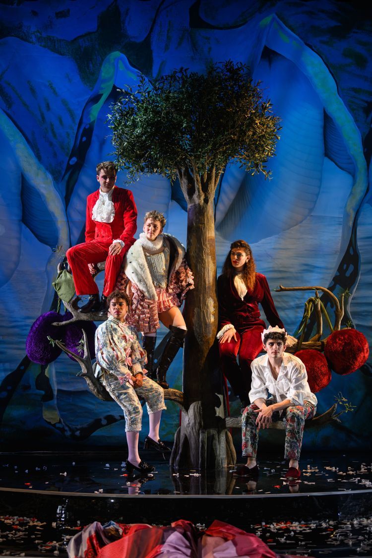 Scene from Orlando - actors standing around tree